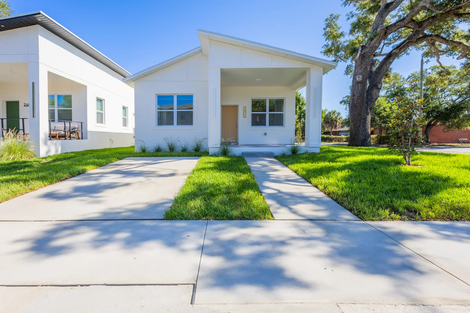 Front porch and lawn of a bright Florida home