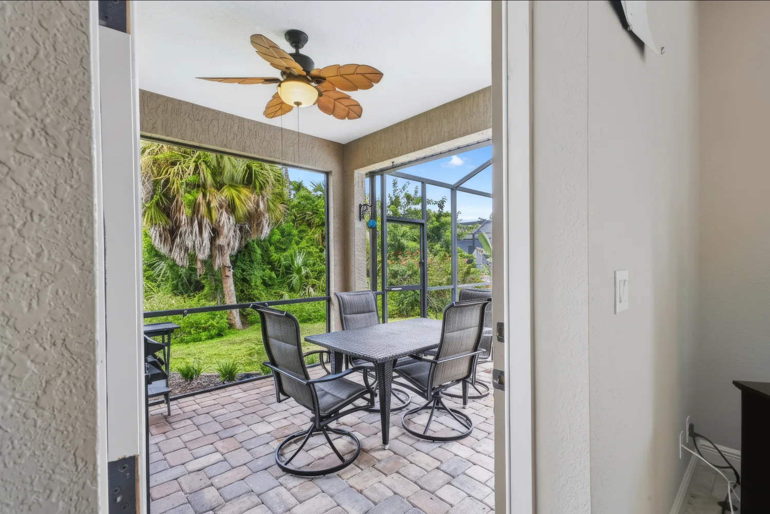 Covered outdoor dining area beside the pool
