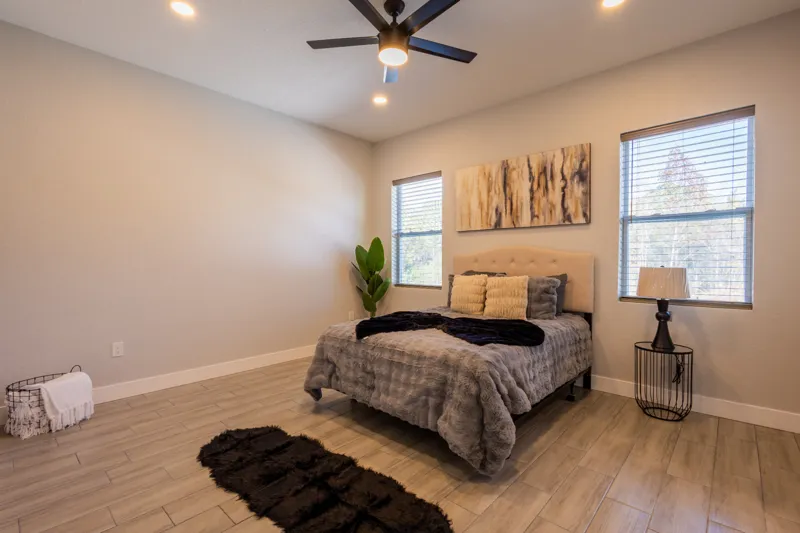 Furnished bedroom with warm lighting