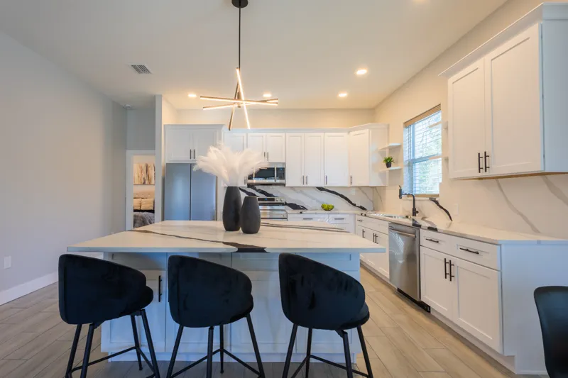 Kitchen island with dark bar stools